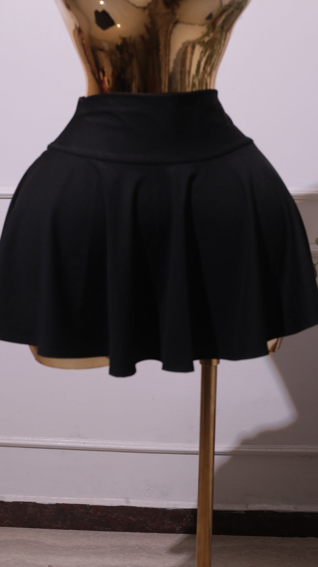 A Black High-waisted Pleated Mini Skater Skirt