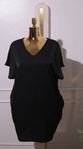 A Black Short-sleeved V-neck Dress, Possibly Made Of Silk Or A Silk Blend