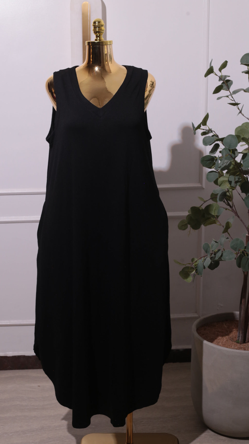 A Black Sleeveless Maxi Dress With A Side Pocket