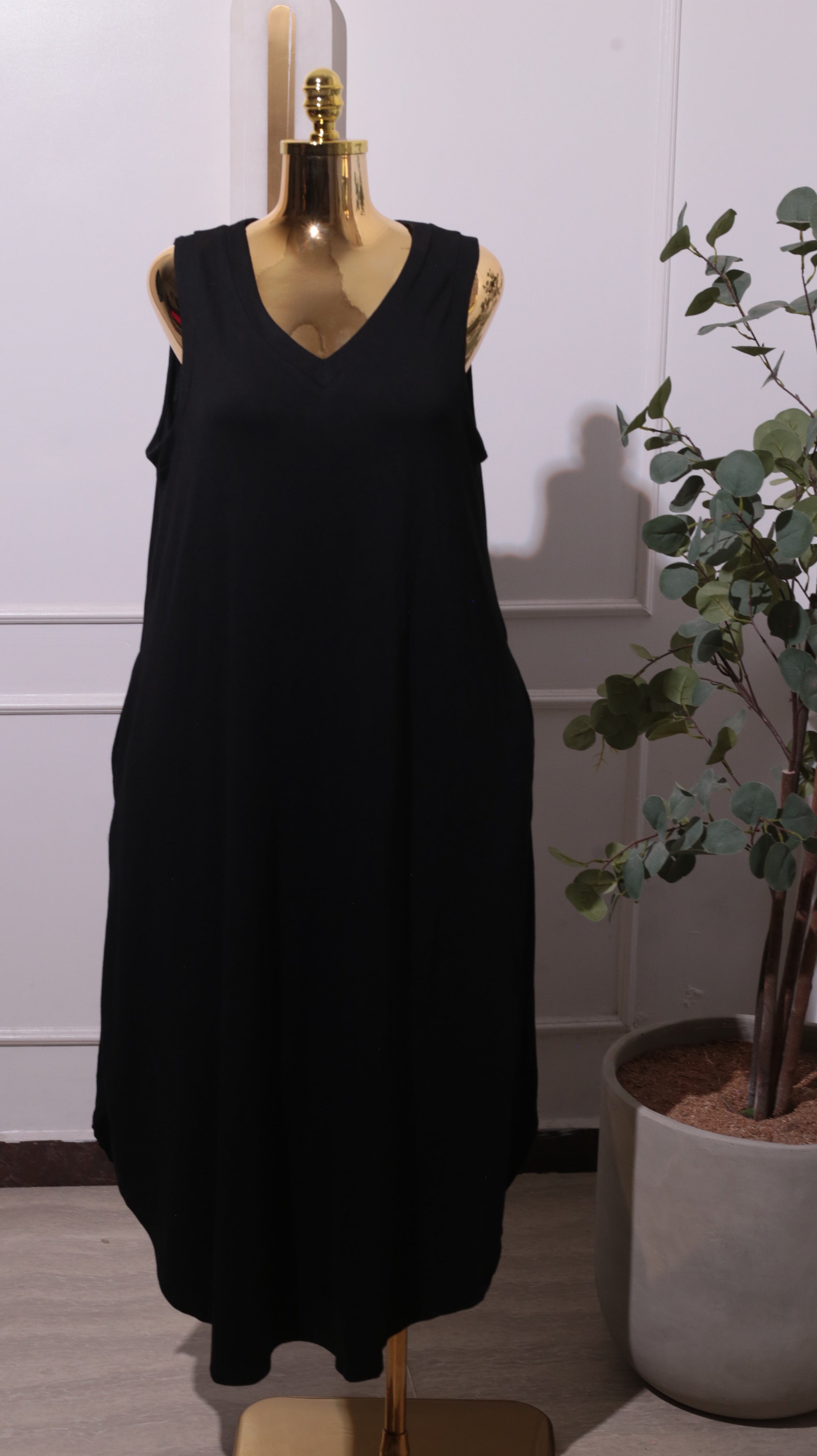 A Black Sleeveless Maxi Dress With A Side Pocket