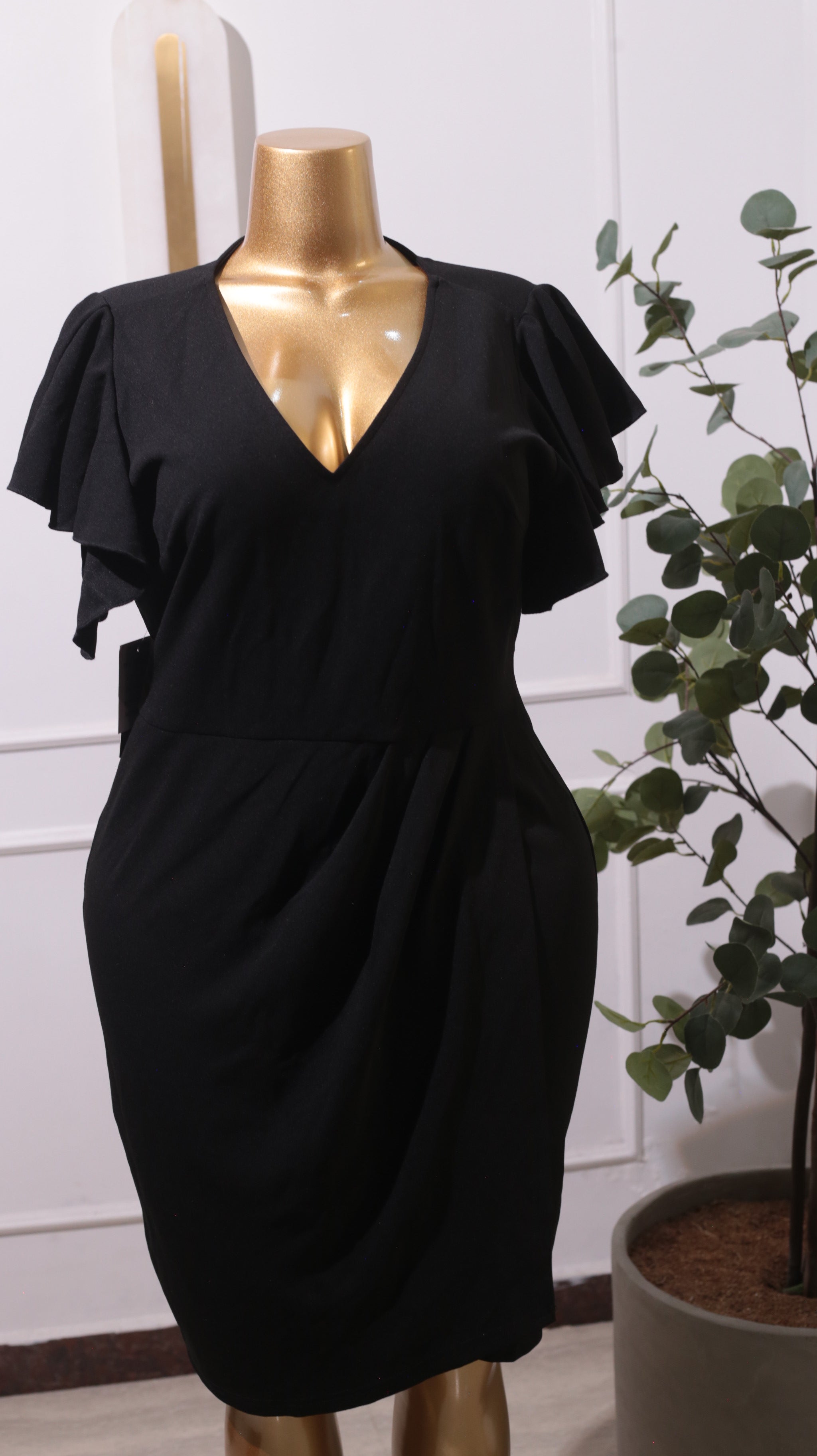A Black V-neck Bodycon Wrap Dress With Short Ruffle Sleeves
