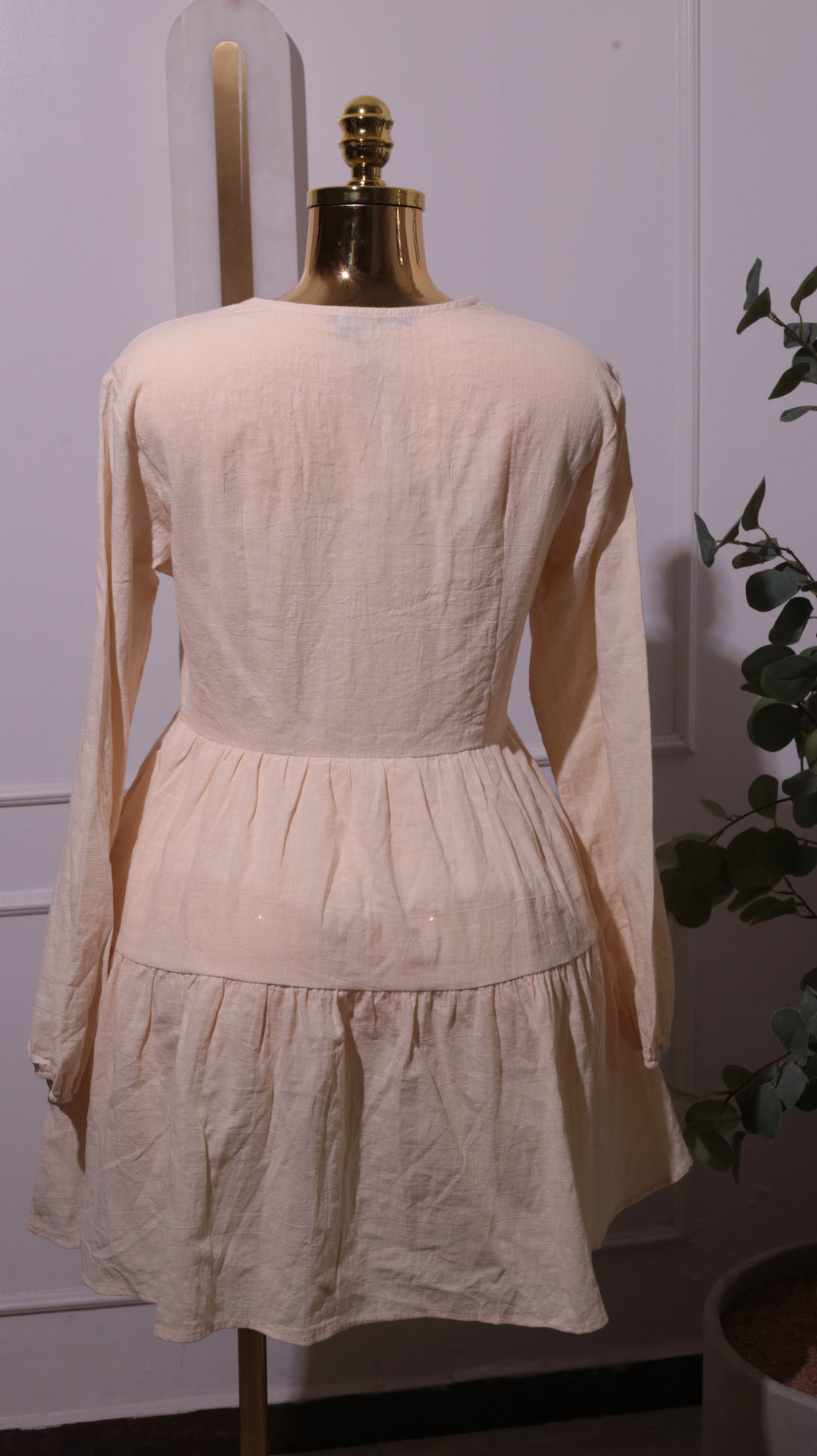 A Cream-colored, Long-sleeved Dress