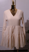 A Cream-colored, Long-sleeved Dress