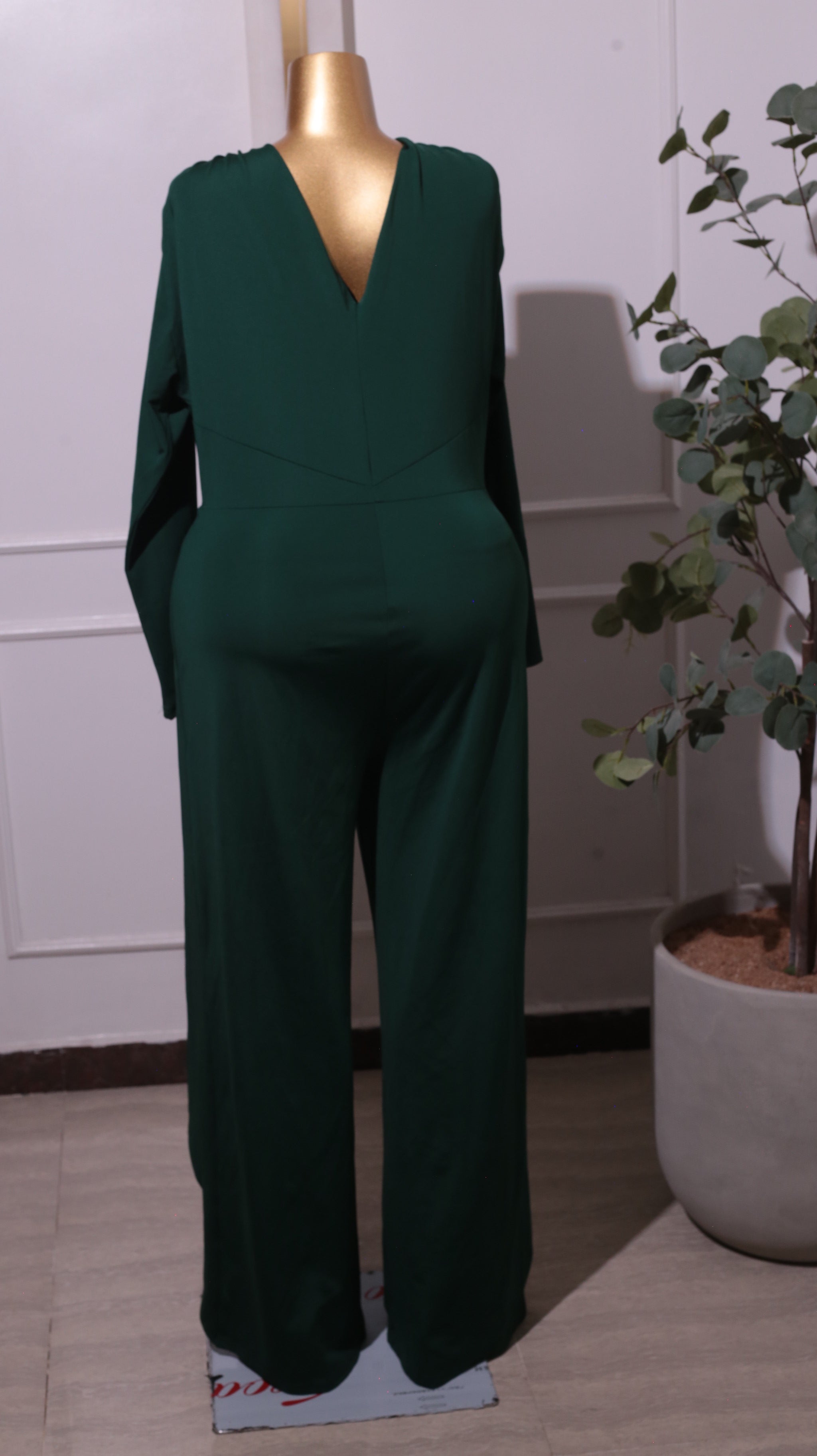 A Dark Green Long-sleeve, Wide-leg Jumpsuit With A Wrap-front Detail