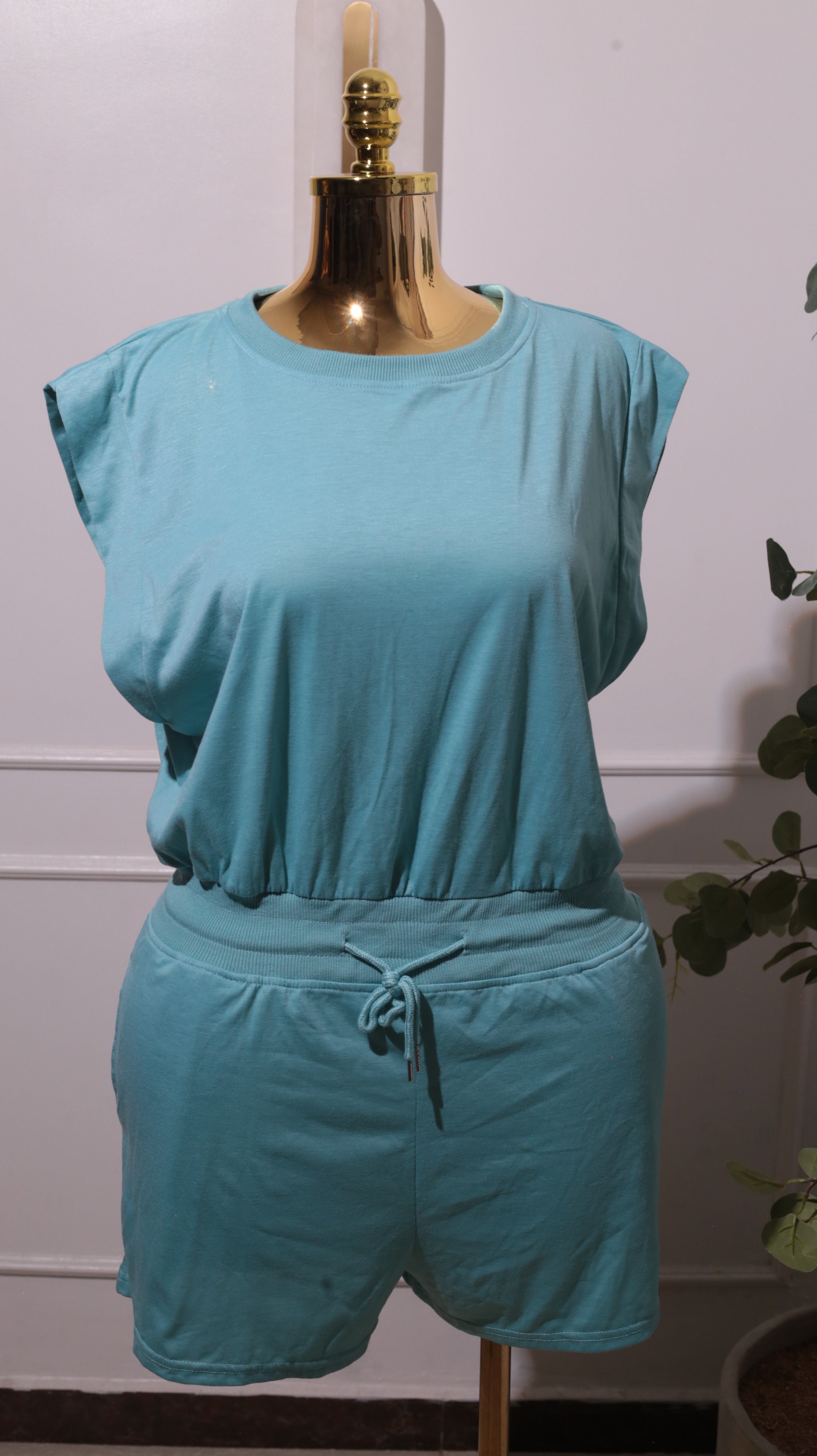 A Light Blue Short-sleeved Romper With A Drawstring Waist