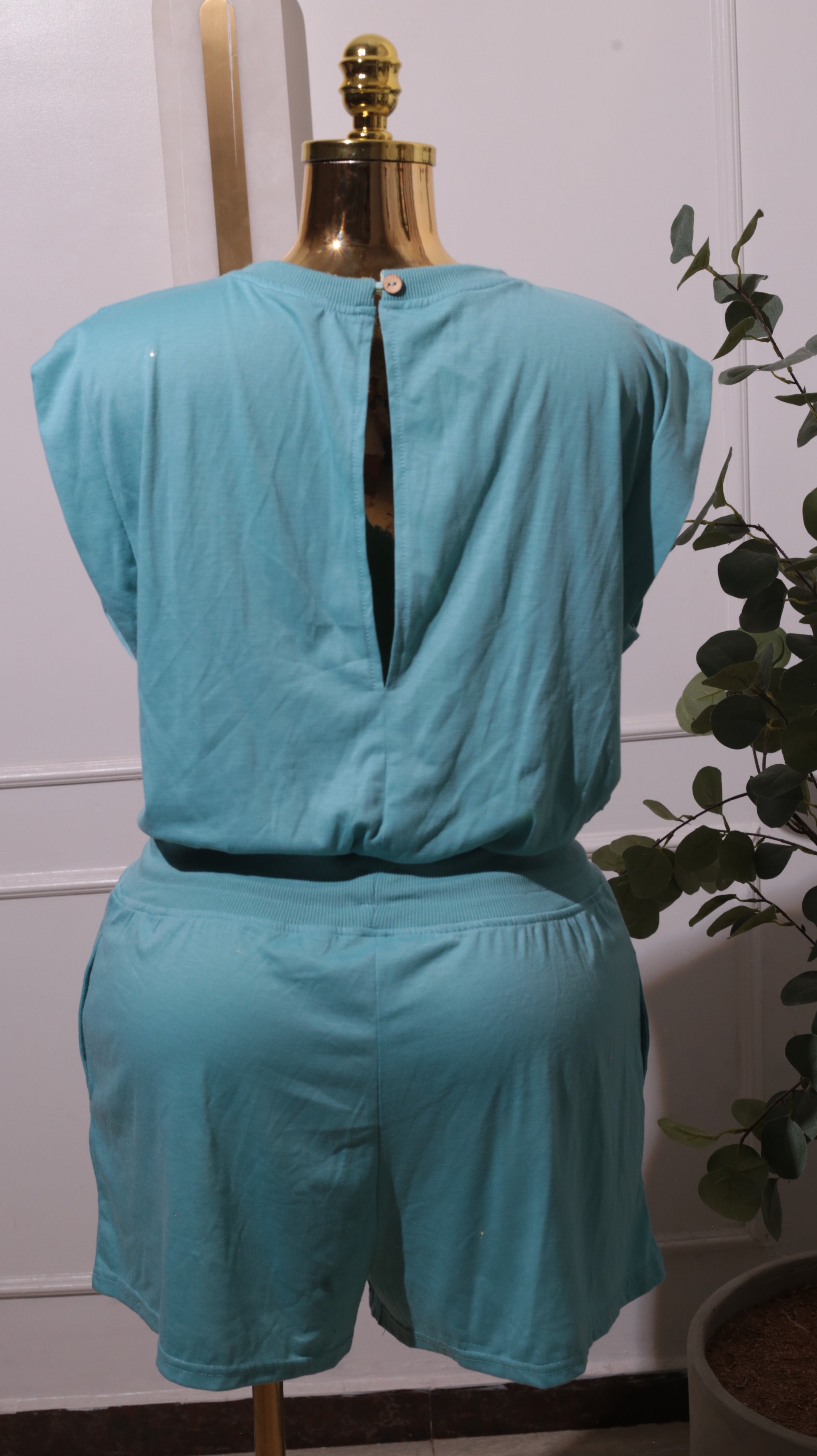 A Light Blue Short-sleeved Romper With A Drawstring Waist