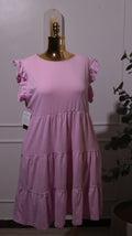 A Pink Tiered Dress With Ruffle Cap Sleeves