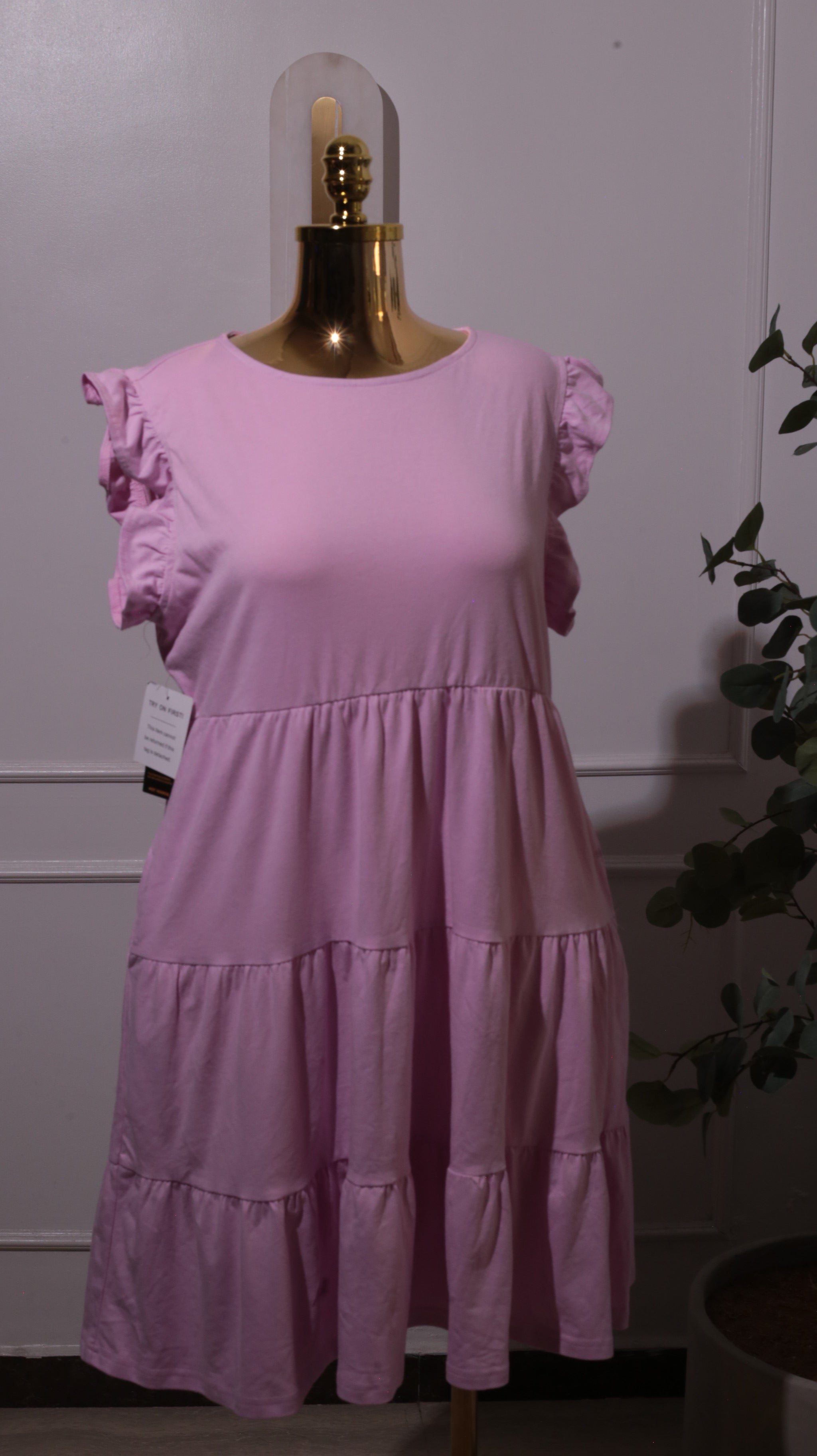 A Pink Tiered Dress With Ruffle Cap Sleeves