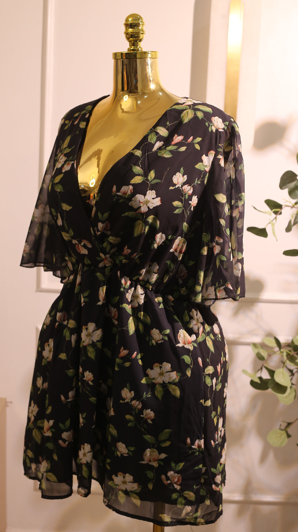 Black Chiffon Mini Dress With A Delicate White And Green Floral Print