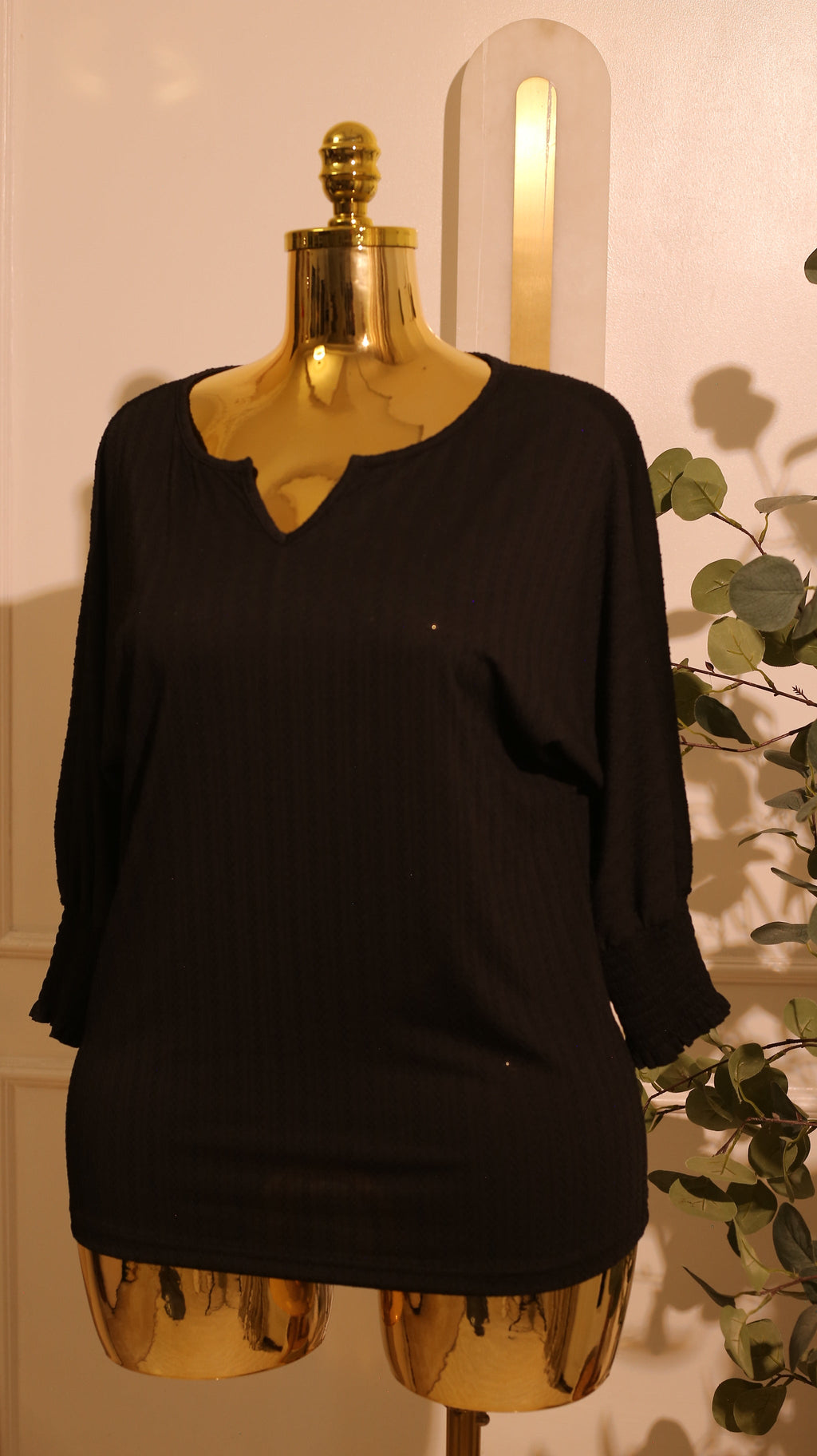 Black, Short-Sleeved Blouse With A V-Neck And A Textured, Vertical Pattern