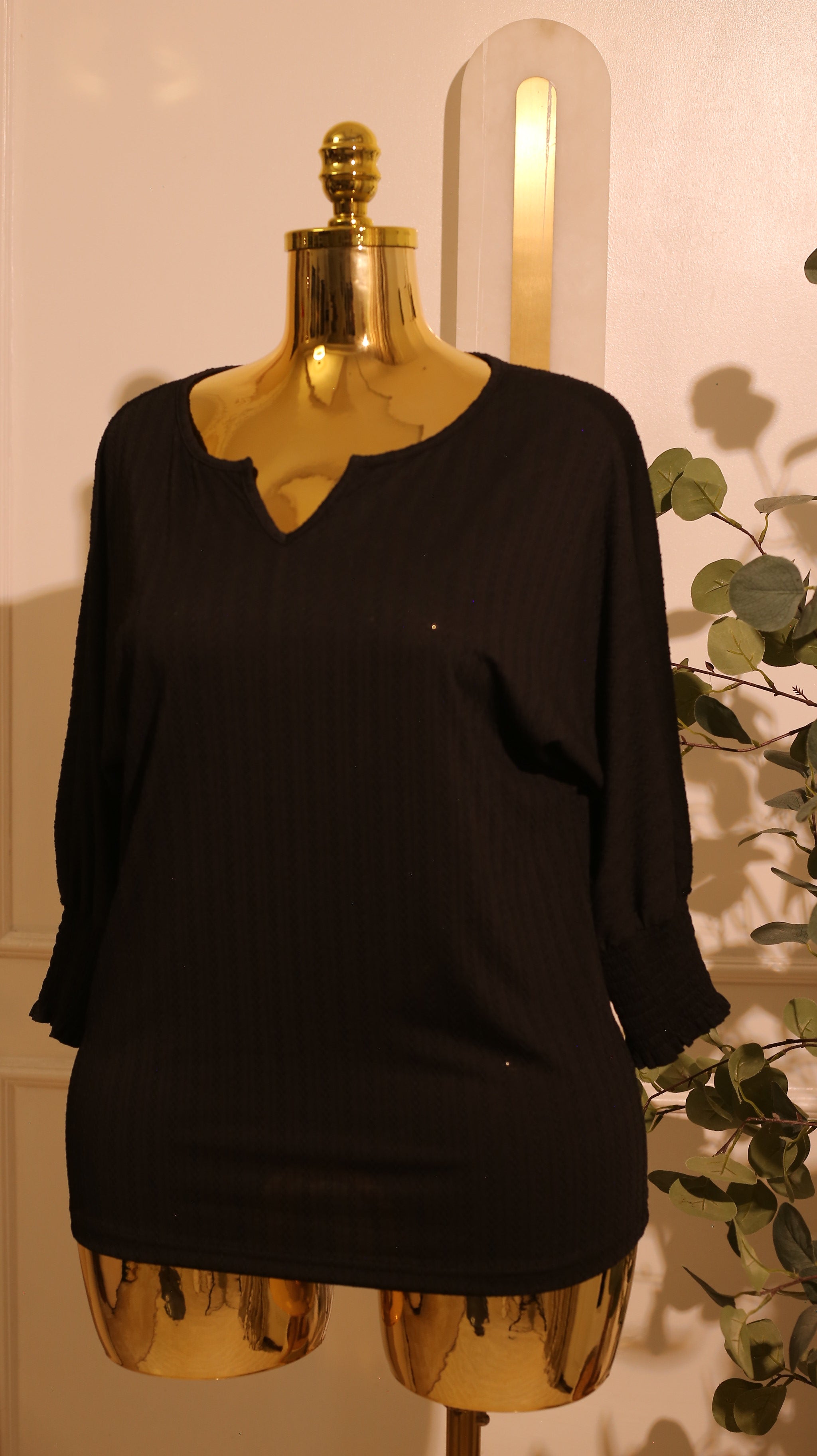 Black, Short-Sleeved Blouse With A V-Neck And A Textured, Vertical Pattern