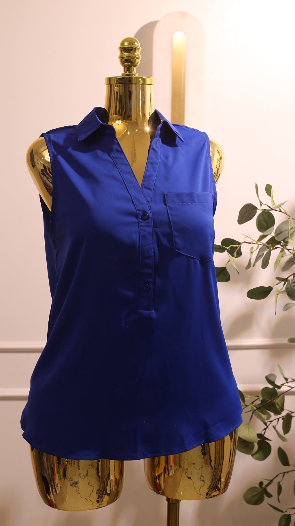Blue Sleeveless Button-Front Sheer Blouse With A Collar And A Single Pocket