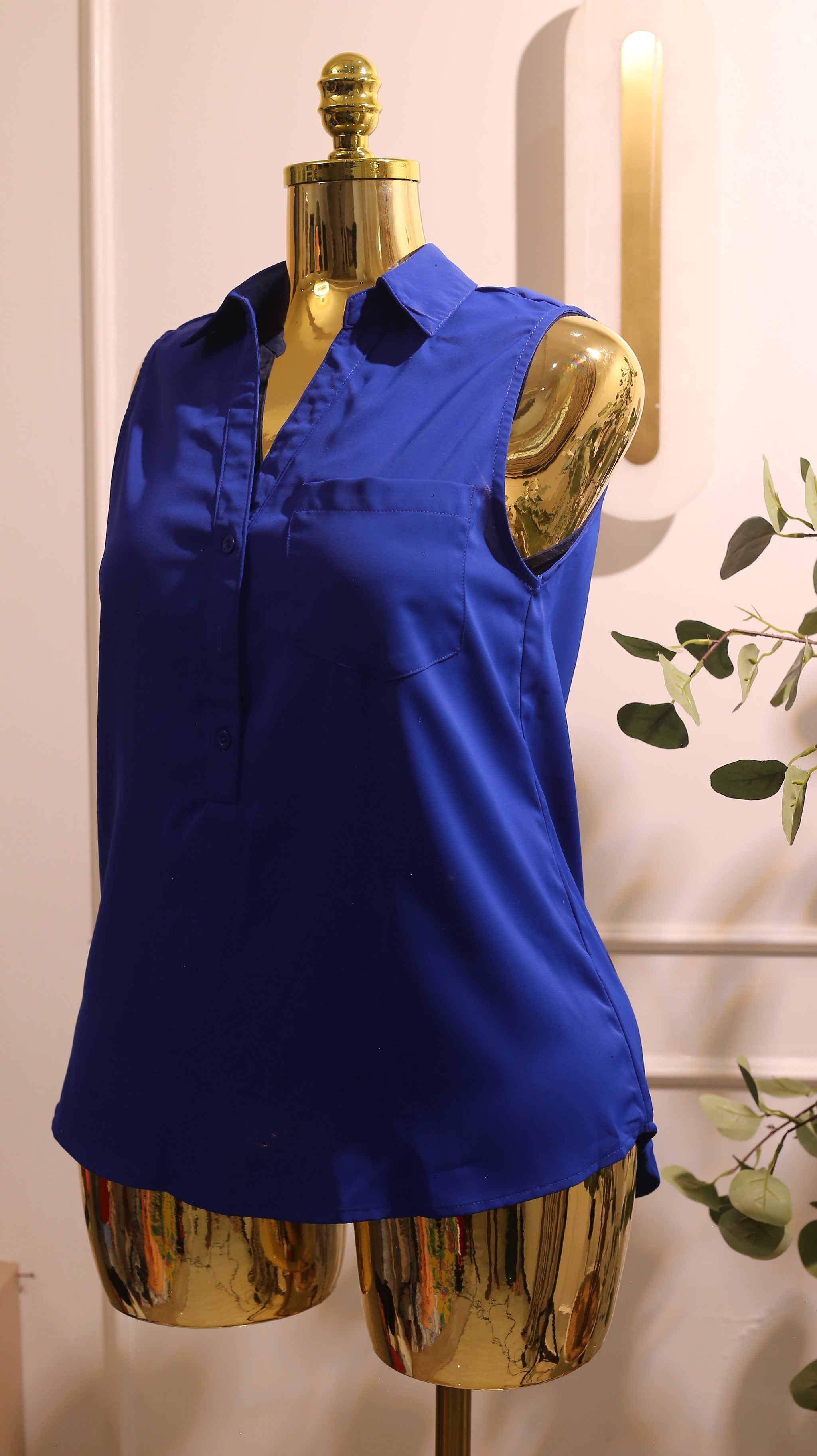 Blue Sleeveless Button-Front Sheer Blouse With A Collar And A Single Pocket