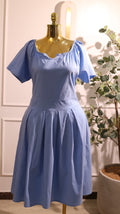 Light Blue Short-Sleeved Off-The-Shoulder Dress With A Gathered Neckline And A Pleated base