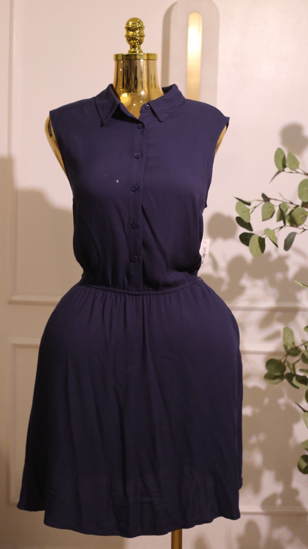 Navy Blue Sleeveless Dress, Possibly Made Of Chiffon Or A Similar Soft Fabric