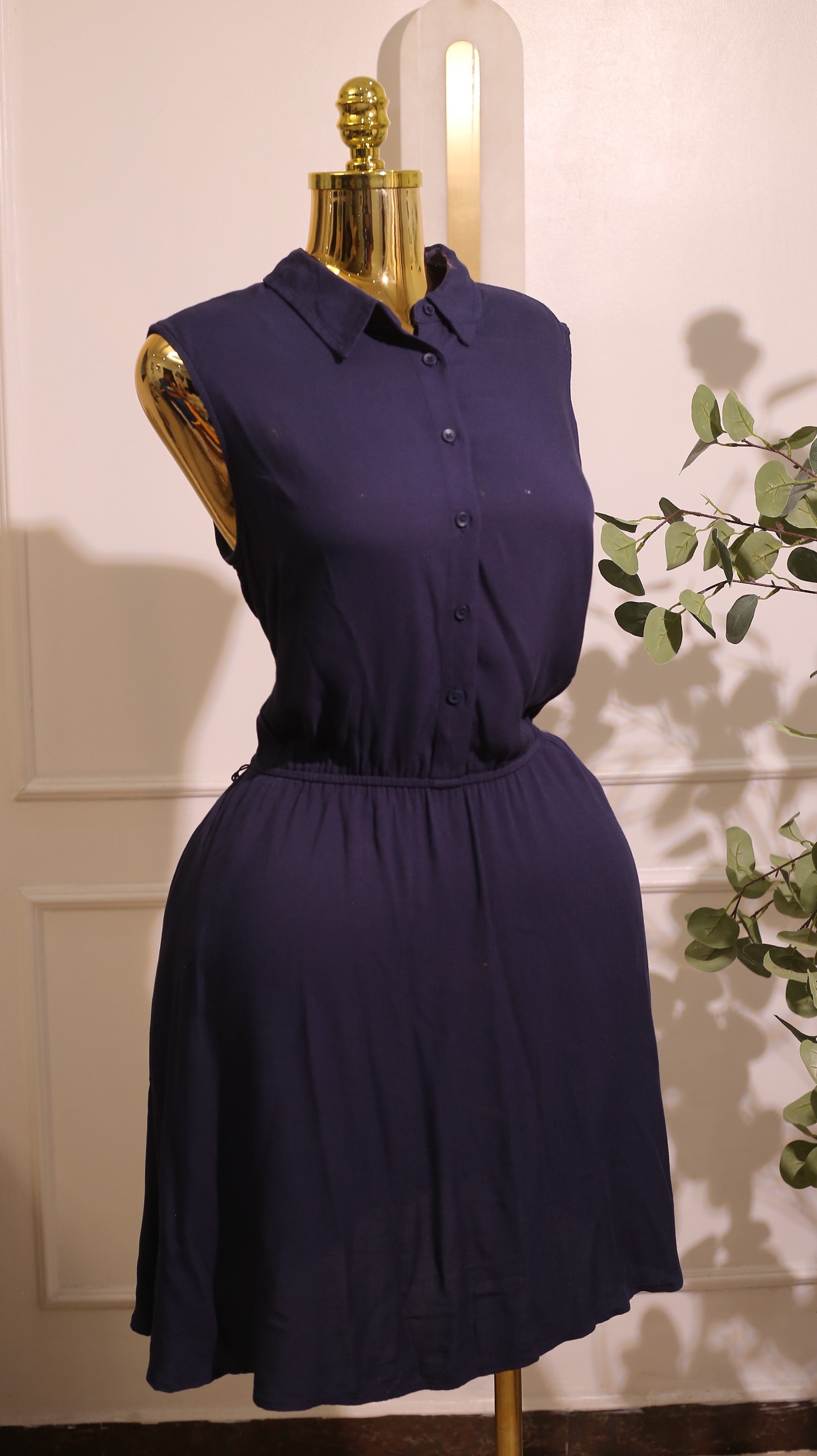 Navy Blue Sleeveless Dress, Possibly Made Of Chiffon Or A Similar Soft Fabric