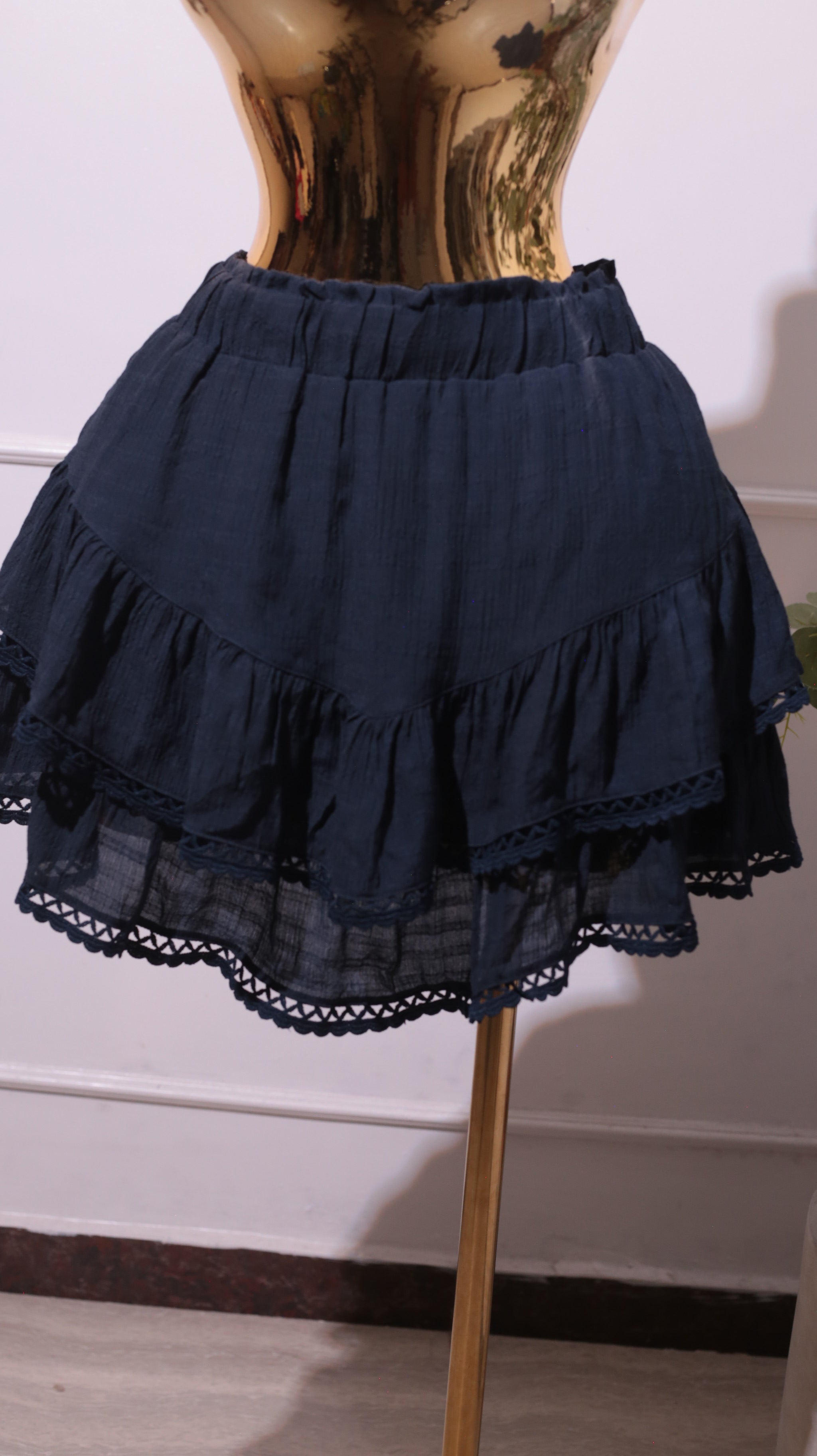 Pair Of Navy Blue Tiered Ruffle Skirts With Lace Trim And An Elastic Waistband