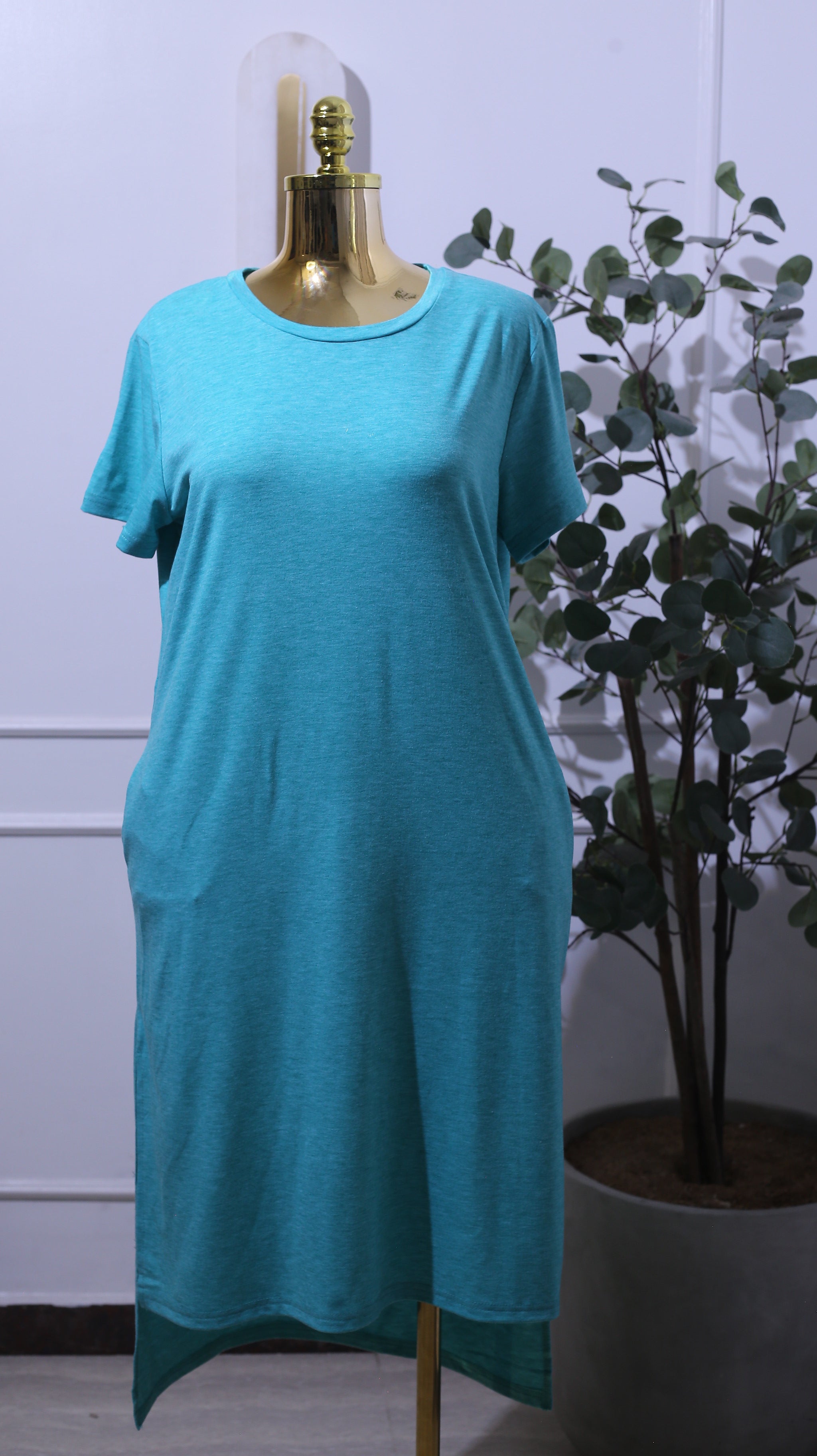Plain Turquoise Dress With A Round Neckline And Short Sleeves