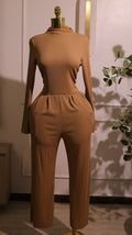 Long-Sleeved Mock-Neck Wide-Leg Jumpsuit In A Tan Or Camel Color, Made From A Soft And Stretchy Material