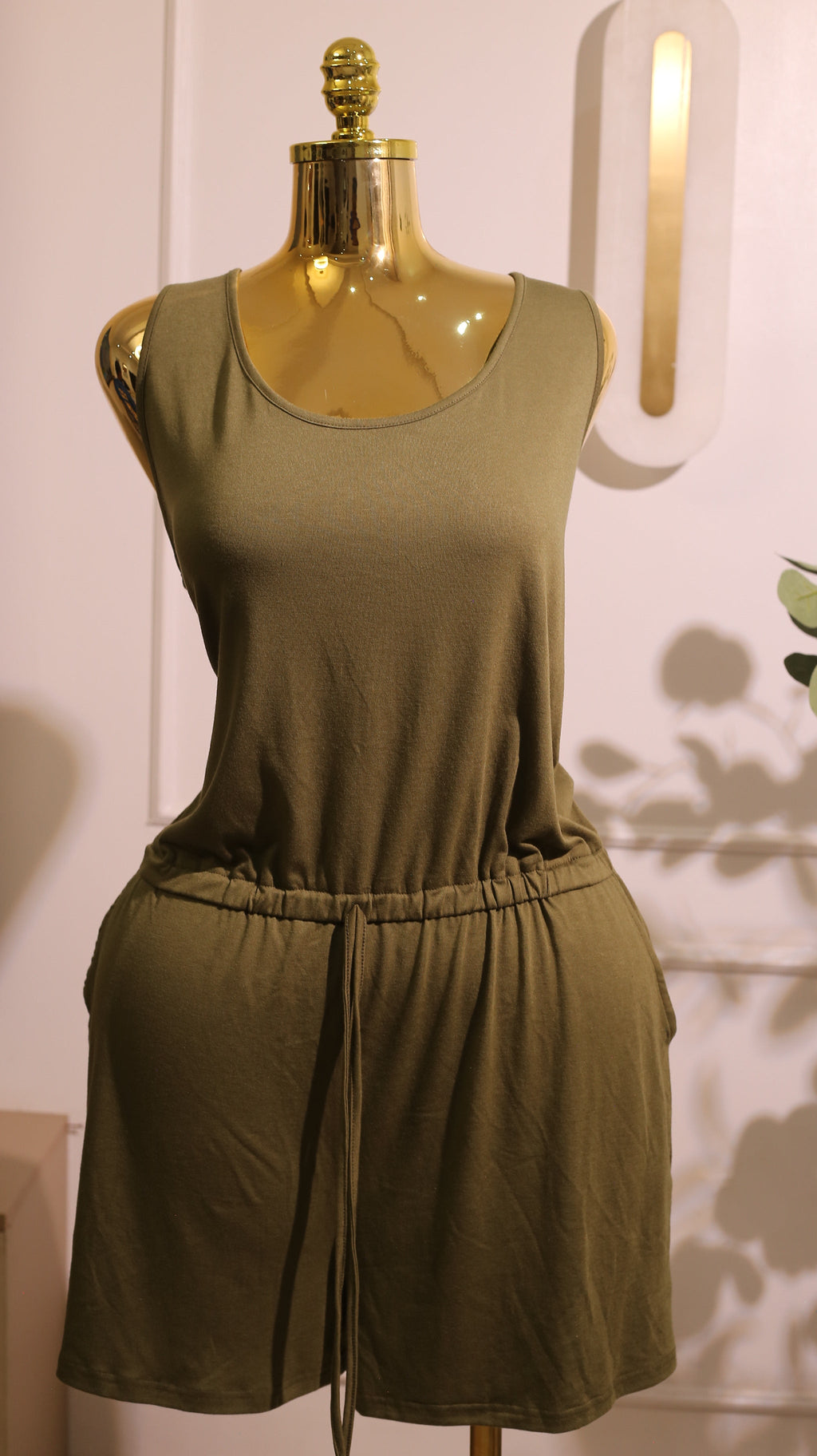 Sleeveless Romper With An Elastic Waist And Keyhole Back In An Olive Green Color
